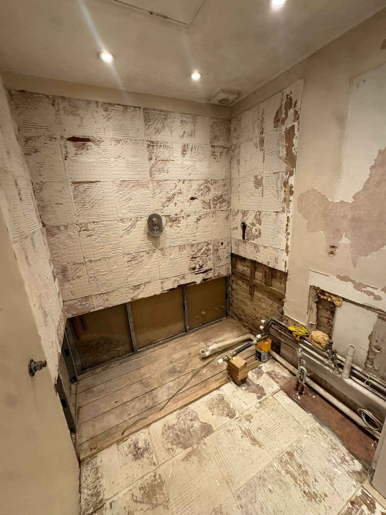 Bathroom before renovation — completely stripped-out space prior to full refurbishment, London